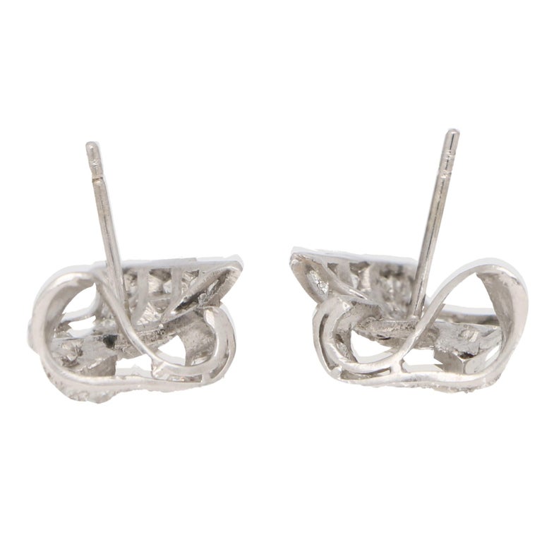 Diamond scroll earrings set in platinum