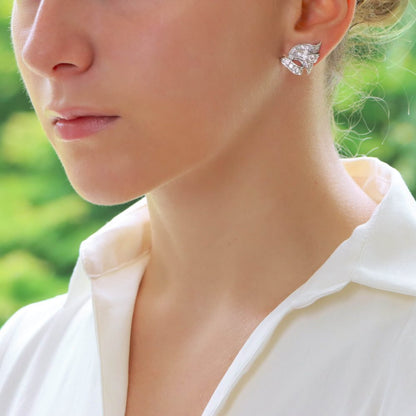 Diamond scroll earrings set in platinum