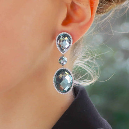 Vintage Roberto Coin blue topaz and diamond drop earrings in white gold.