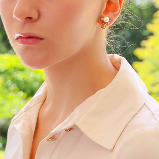 Pearl and diamond twisted rope earrings in gold.