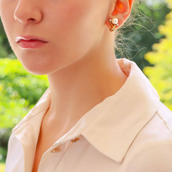 Pearl and diamond twisted rope earrings in gold.