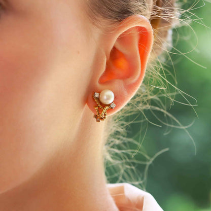 Pearl and diamond twisted rope earrings in gold.