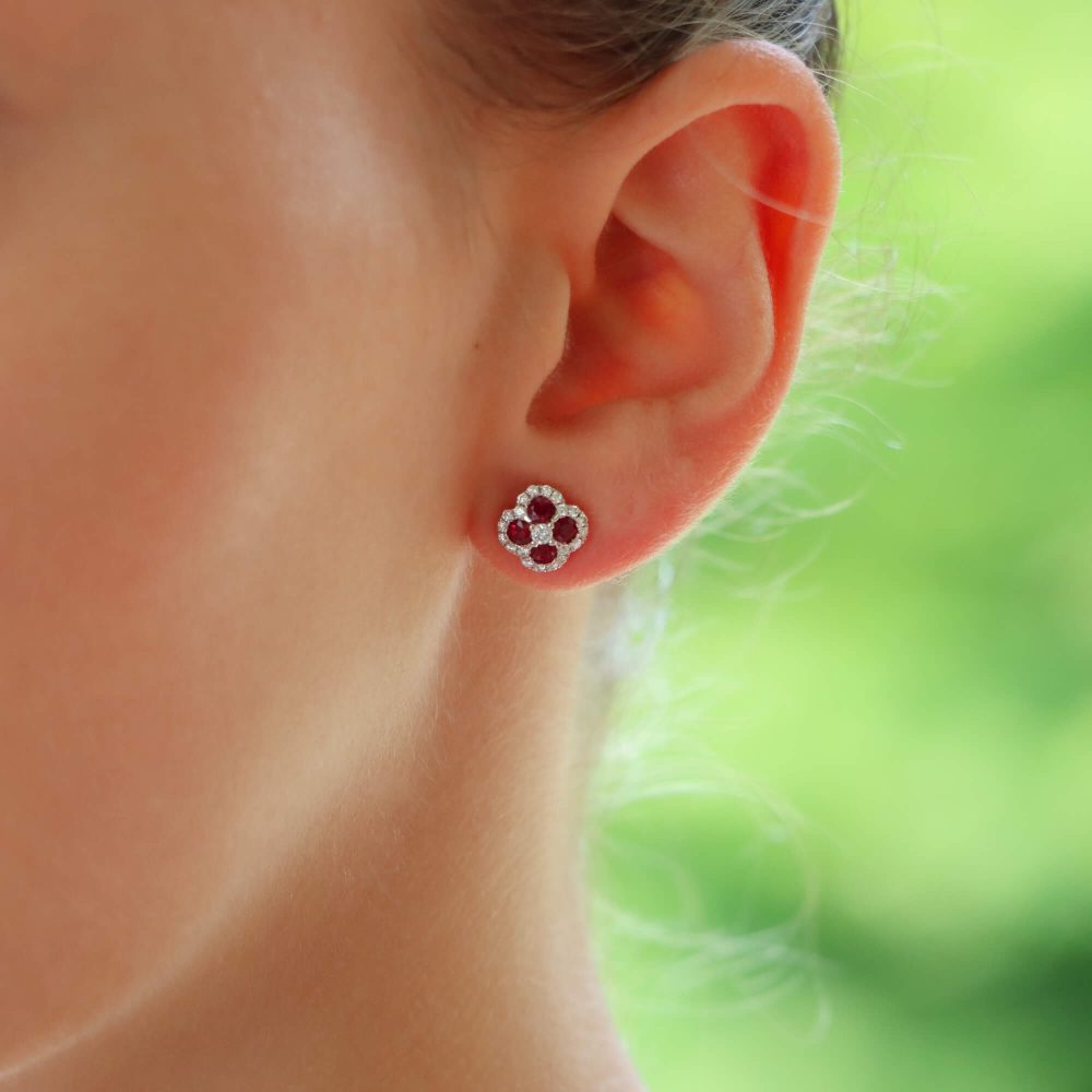 Ruby and diamond cluster earrings in white gold.