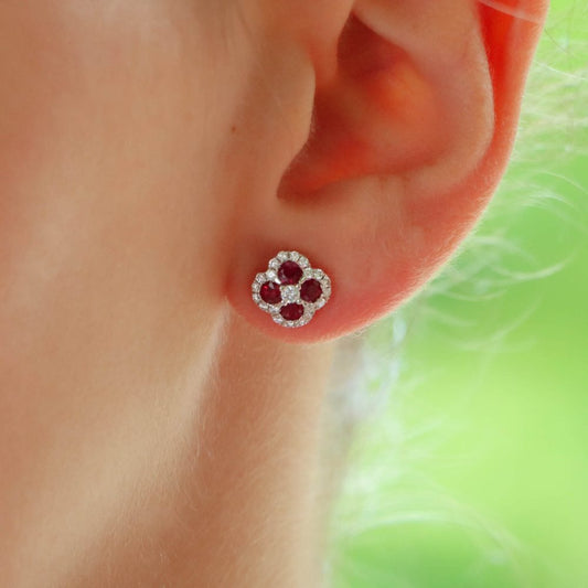 Ruby and diamond cluster earrings in white gold.