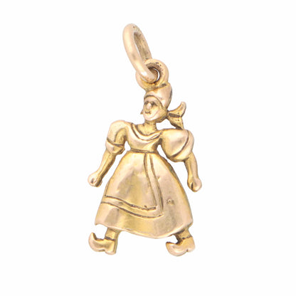 A yellow gold Dutch lady in a dress charm, on a white background