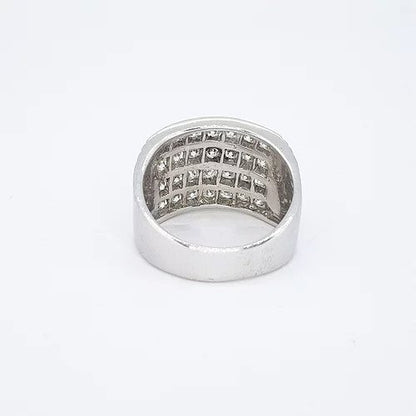 Channel Set Diamond Dress Ring; featuring four horizontal rows channel set with 2.00 carats brilliant cut diamonds, ribbed shoulders, in 18ct white gold