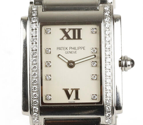 Patek Philippe Twenty-4 Stainless Steel 4910 Ladies 25mm Diamond Dial Quartz Rectangular Watch, white dial, diamond dot hour markers and Roman numerals, diamonds set to each side of the dial, blue cabochon gem set crown, Patek stainless steel bracelet with a hidden double deployment clasp.