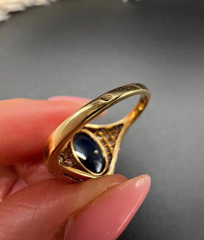 Close-up of French marks on a yellow gold ring shank