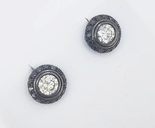 White and Black Diamond Halo Detachable Stud Earrings; 0.80cts white round brilliant-cut diamonds surrounded by 0.96cts carved black diamond