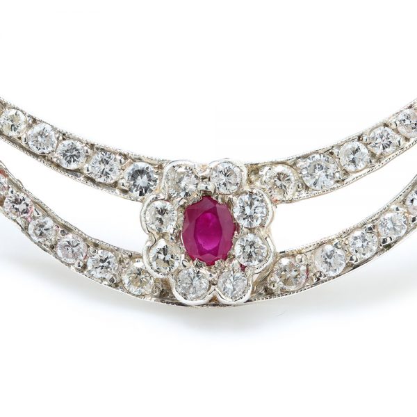 Antique Edwardian Ruby and Old Cut Diamond Cluster Crescent Brooch; oval Burma ruby and old-cut diamond cluster on diamond-set split crescent