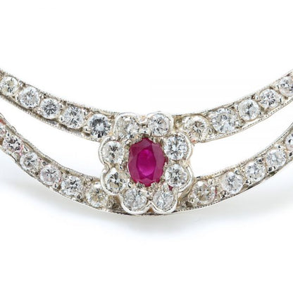 Antique Edwardian Ruby and Old Cut Diamond Cluster Crescent Brooch; oval Burma ruby and old-cut diamond cluster on diamond-set split crescent