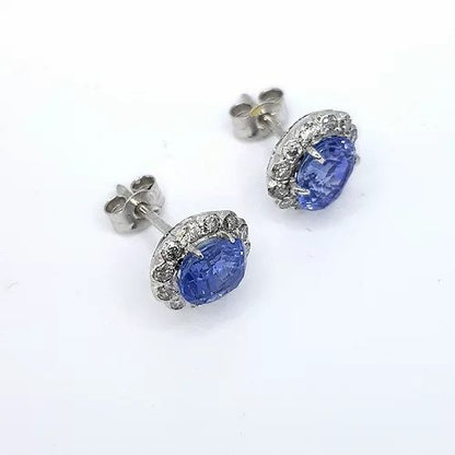 Sapphire and Diamond Oval Cluster Earrings; 2.00cts oval faceted sapphires, surrounded by brilliant-cut diamonds, in 18ct white gold