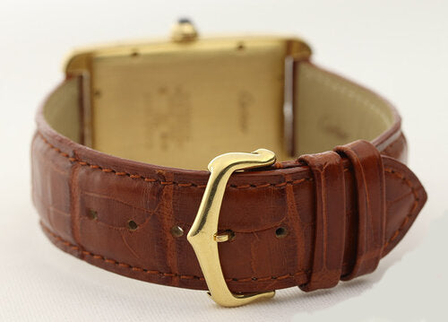 Cartier Tank Americaine Gents 18ct Yellow Gold Automatic, Ref 1740, white dial, Roman numerals, date indicator, blue steel hands, sapphire crown, sapphire crystal, on a Cartier brown leather strap with 18ct yellow gold pin buckle, with Cartier box and papers.