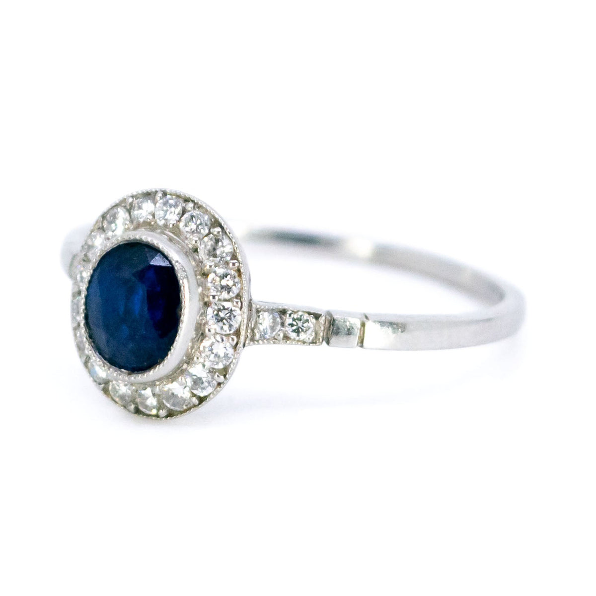 Sapphire 0.65 Carat, Diamond 0.25 Carat and Platinum Halo Cluster Ring