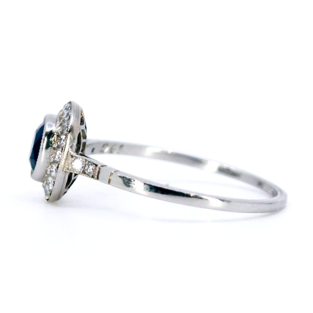 Sapphire 0.65 Carat, Diamond 0.25 Carat and Platinum Halo Cluster Ring