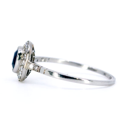 Sapphire 0.65 Carat, Diamond 0.25 Carat and Platinum Halo Cluster Ring