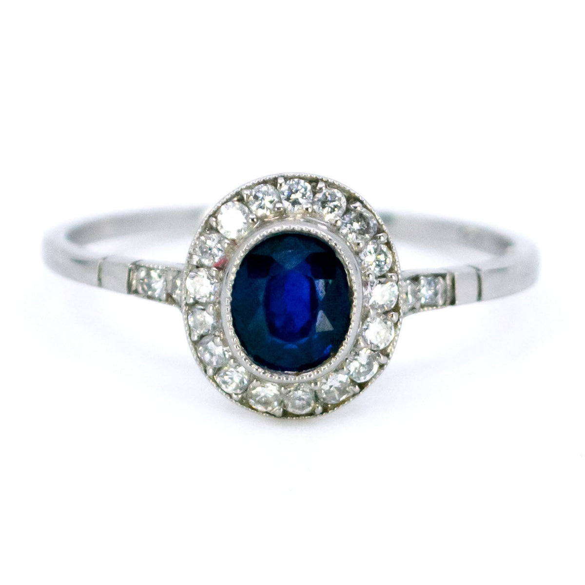 Sapphire 0.65 Carat, Diamond 0.25 Carat and Platinum Halo Cluster Ring