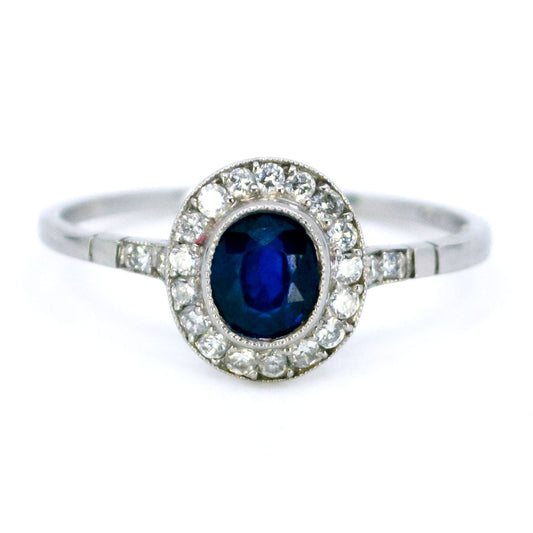 Sapphire 0.65 Carat, Diamond 0.25 Carat and Platinum Halo Cluster Ring