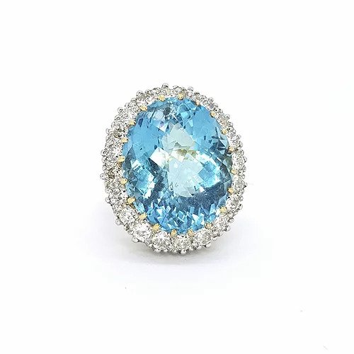 Aquamarine and Diamond Oval Cluster Cocktail Ring; 23.85ct oval aquamarine surrounded by 2.20cts brilliant-cut diamonds, in 18ct yellow gold.