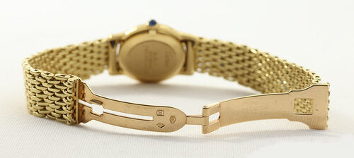 Cartier Classic Round Ladies 18ct Yellow Gold Original Diamond Case, white dial, Roman numerals, sapphire cabochon crown, original diamond case, manual mechanical winding movement, 18ct yellow gold bracelet with hidden clasp