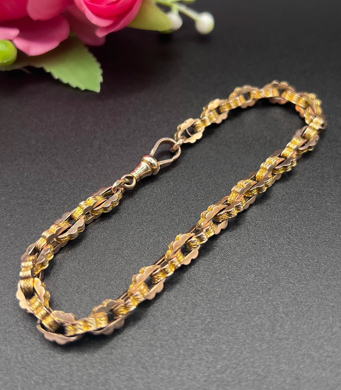 A fancy link yellow gold bracelet with a lobster claw clasp