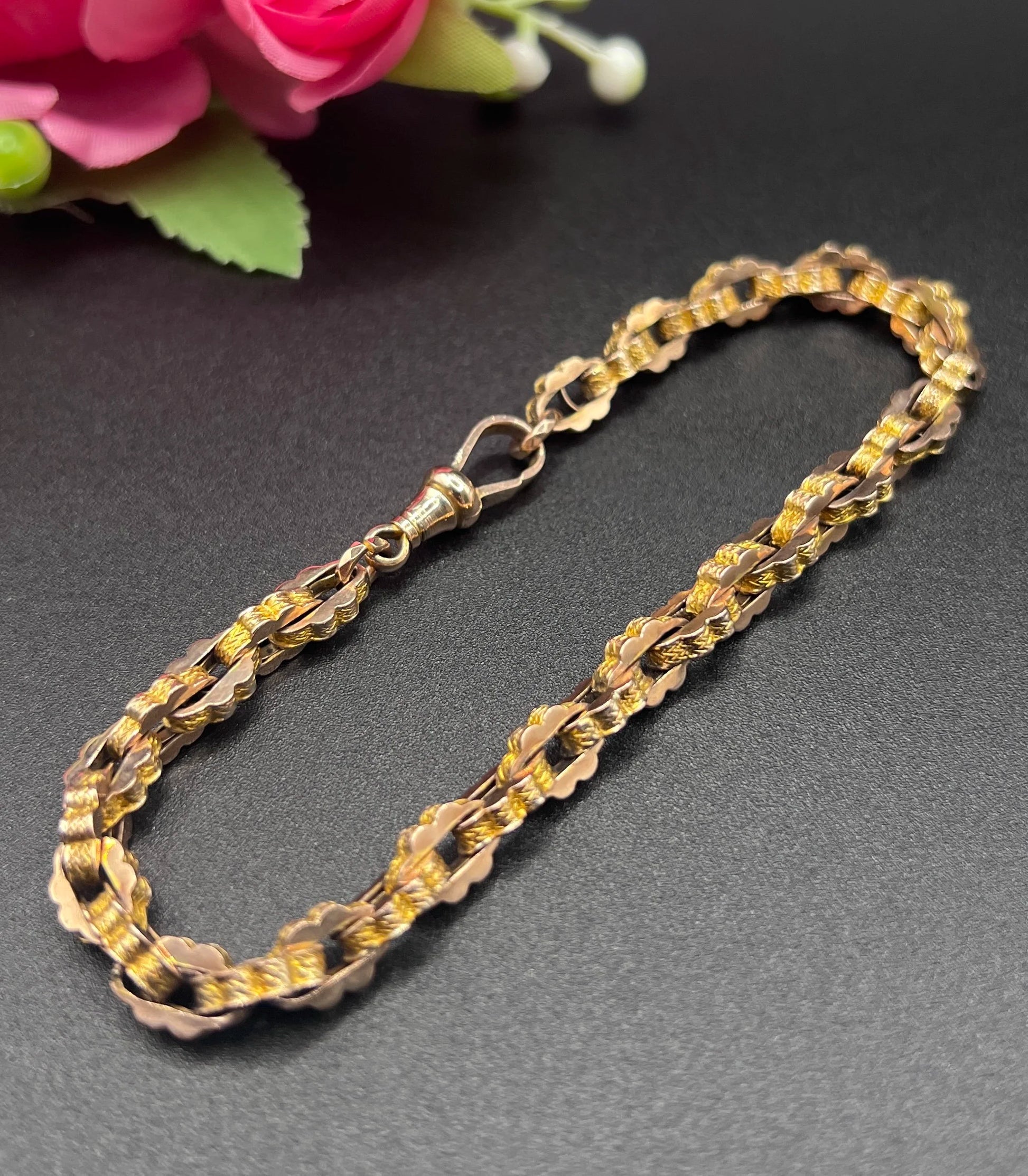 A fancy link yellow gold bracelet with a lobster claw clasp