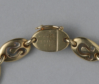 Van Cleef and Arpels Vintage 18ct Yellow Gold Leo Bracelet; chunky oval links with cut out Leo zodiac symbols. Circa 1970. Signed and numbered