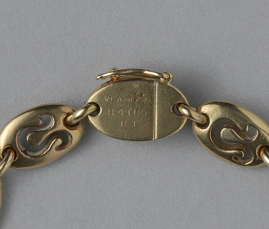 Van Cleef and Arpels Vintage 18ct Yellow Gold Leo Bracelet; chunky oval links with cut out Leo zodiac symbols. Circa 1970. Signed and numbered