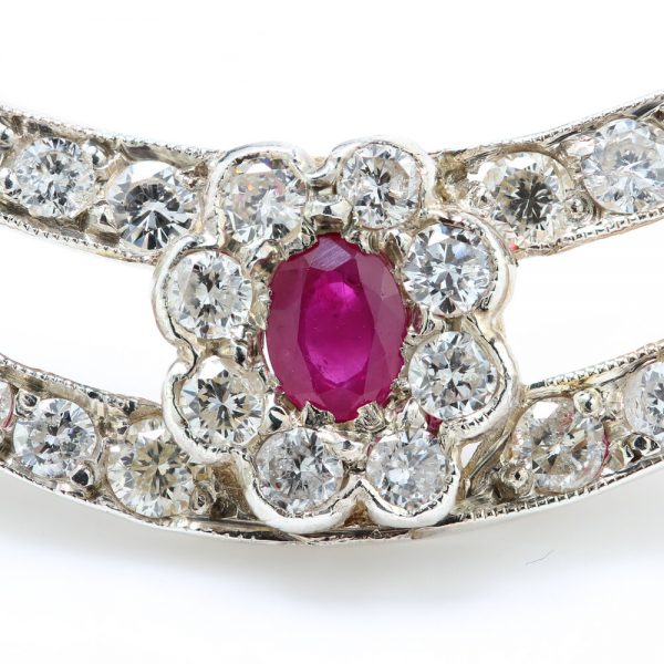 Antique Edwardian Ruby and Old Cut Diamond Cluster Crescent Brooch; oval Burma ruby and old-cut diamond cluster on diamond-set split crescent