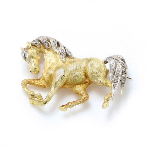 Vintage 18ct Yellow Gold Horse Brooch with Diamonds; with textured detailing to the gold body, accented with diamonds to the mane and tail. Circa 1970s