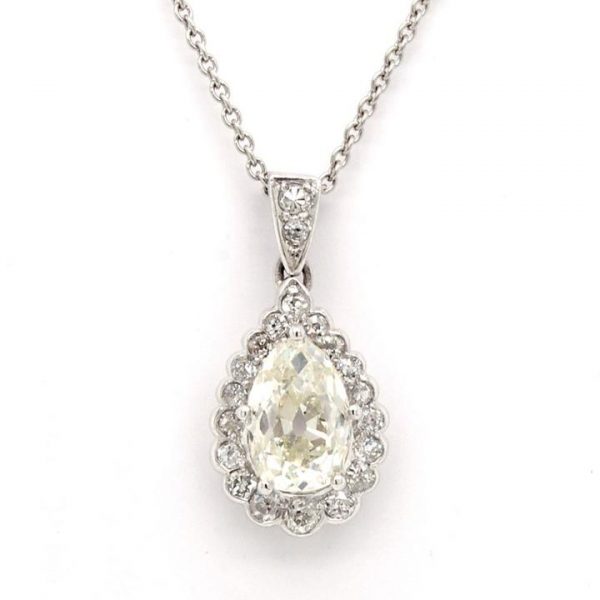 Vintage Diamond Pear Shaped Cluster Drop Pendant; central pear cut diamond surrounded by round faceted diamonds, 1.48 carat total, 18ct white gold