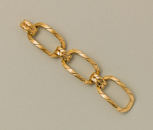Vintage Gold Oversized Fancy Link Bracelet; comprised of three large links of chunky twisted gold wires designed as large curved segments held by three smaller double links