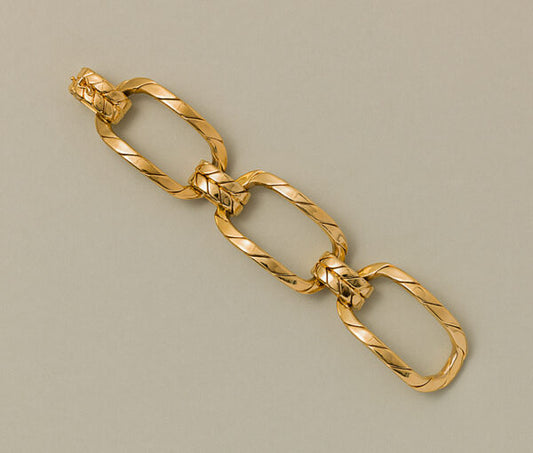 Vintage Gold Oversized Fancy Link Bracelet; comprised of three large links of chunky twisted gold wires designed as large curved segments held by three smaller double links