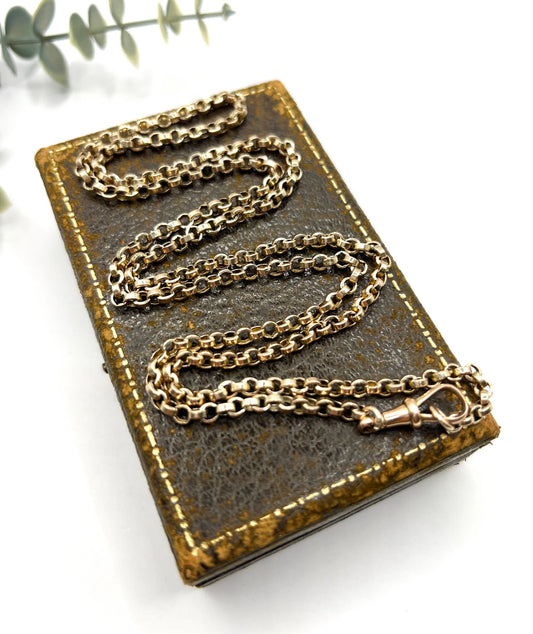 A gold rolo link chain necklace with swivel clasp
