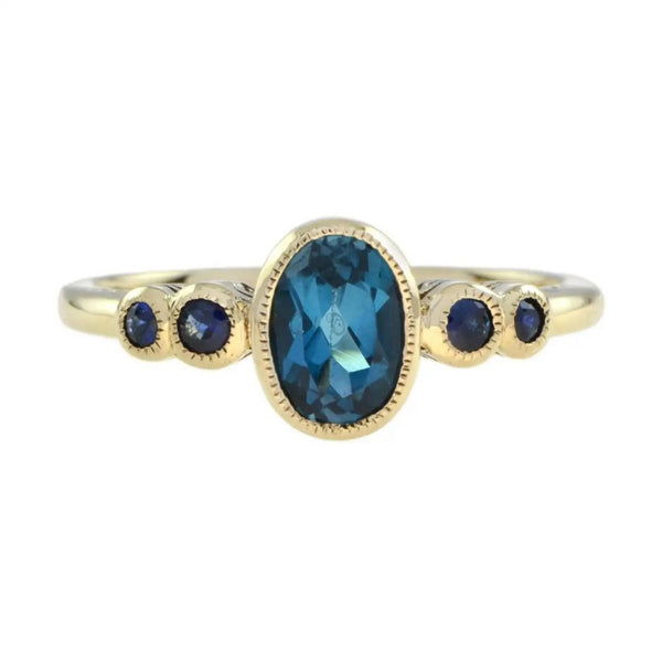 1.15ct Oval Blue Topaz and Sapphire Five Stone Ring