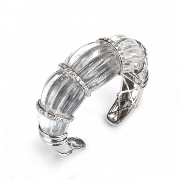 Rock Crystal and Diamond Cuff Bangle Bracelet; modern carved fluted rock crystal with four 18ct white gold spacer sections set with 2.50cts round brilliant-cut diamonds, 18ct white gold ends