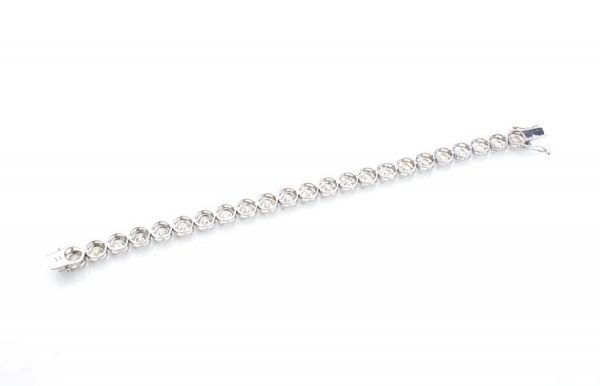 Vintage Diamond Tennis Bracelet, set with 23 round brilliant-cut diamonds, 23.00 carat total, mounted in 18ct white gold. Circa 1970's