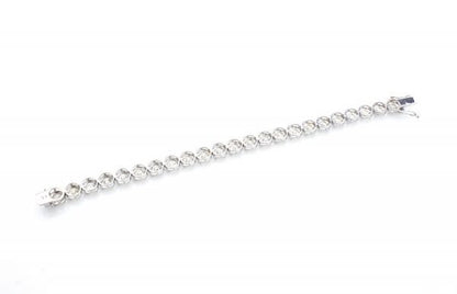 Vintage Diamond Tennis Bracelet, set with 23 round brilliant-cut diamonds, 23.00 carat total, mounted in 18ct white gold. Circa 1970's