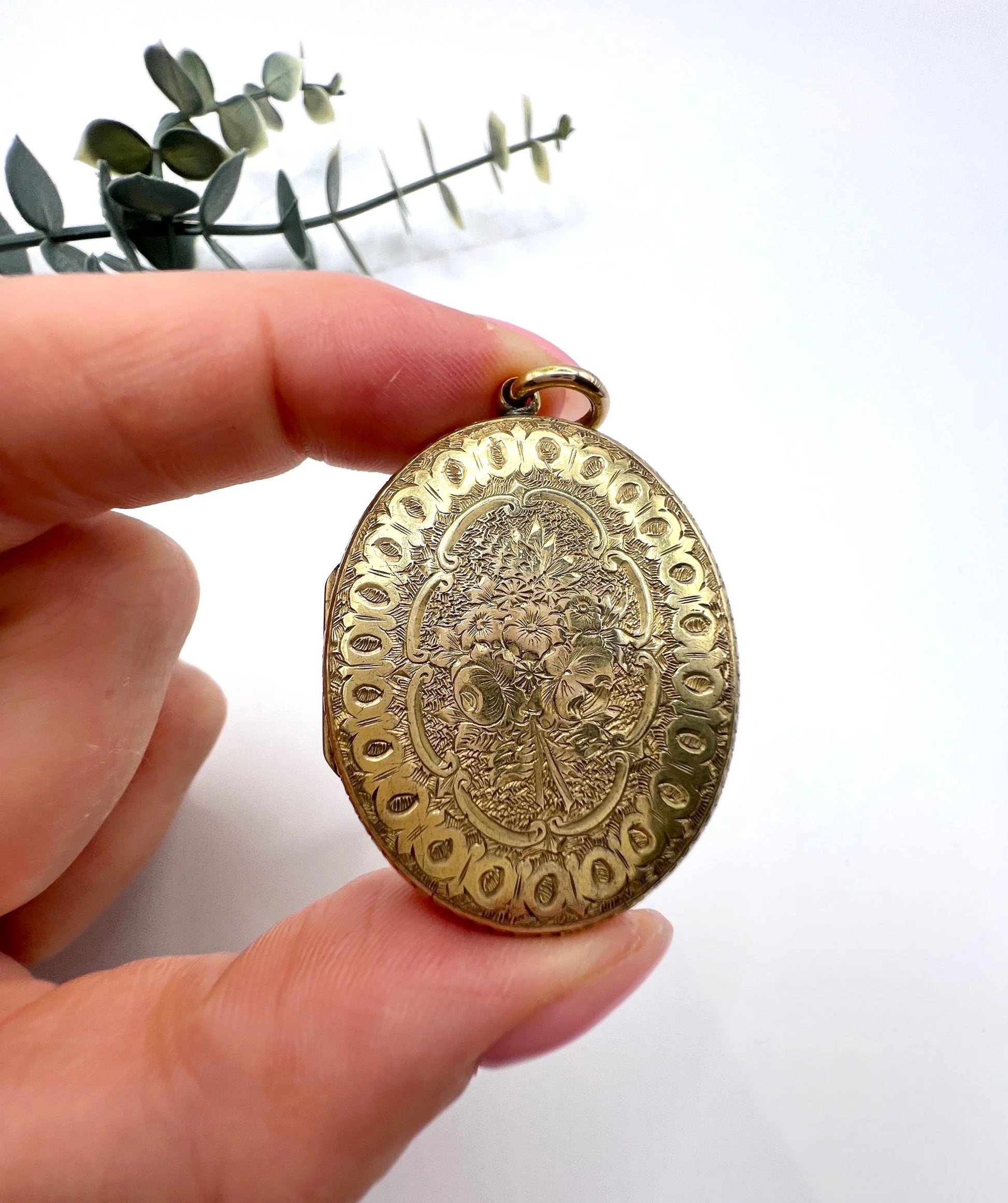 Early Victorian 15 Carat Yellow Gold Floral Engraved Oval Shaped Locket, Circa 1860