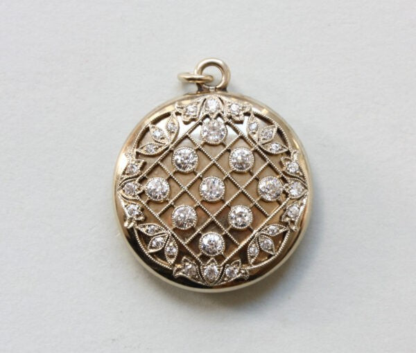 Antique Edwardian Tiffany and Co Diamond Set 20ct Gold Round Locket; diagonal, geometric and floral decoration, mille griffe set old-cut diamonds, Signed