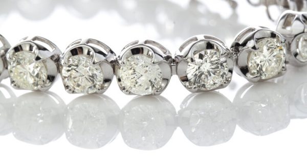 Vintage Diamond Tennis Bracelet, set with 23 round brilliant-cut diamonds, 23.00 carat total, mounted in 18ct white gold. Circa 1970's