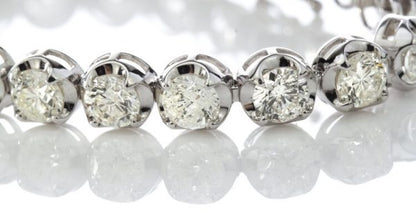 Vintage Diamond Tennis Bracelet, set with 23 round brilliant-cut diamonds, 23.00 carat total, mounted in 18ct white gold. Circa 1970's