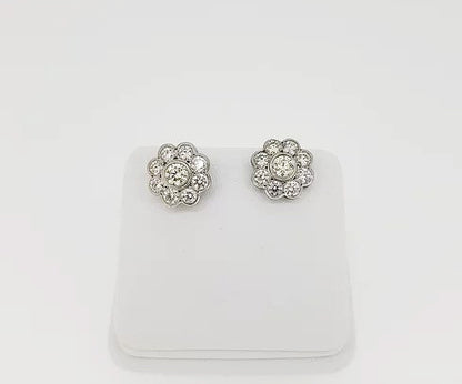 Diamond Daisy Flower Cluster Stud Earrings, mounted in 18ct white gold, in a rub-over setting with fine millegrain borders.