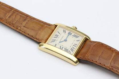 Cartier Tank Francaise Midsize 18ct Yellow Gold Quartz Watch, Ref 1821, white dial, Roman numerals, blued steel hands, blue cabochon crown, sapphire crystal, Cartier brown leather strap with 18ct pin buckle.