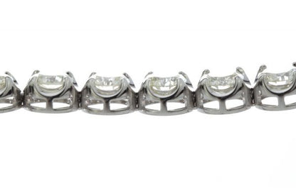 Vintage Diamond Tennis Bracelet, set with 23 round brilliant-cut diamonds, 23.00 carat total, mounted in 18ct white gold. Circa 1970's