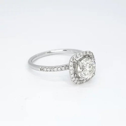 Diamond Halo Cluster Ring, 1.00ct round brilliant-cut diamond surrounded by a halo of diamonds, diamond set shoulders, 1.35 carat total, 18ct white gold