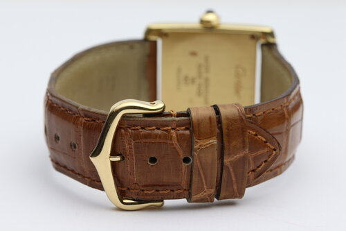 Cartier Tank Francaise Midsize 18ct Yellow Gold Quartz Watch, Ref 1821, white dial, Roman numerals, blued steel hands, blue cabochon crown, sapphire crystal, Cartier brown leather strap with 18ct pin buckle.