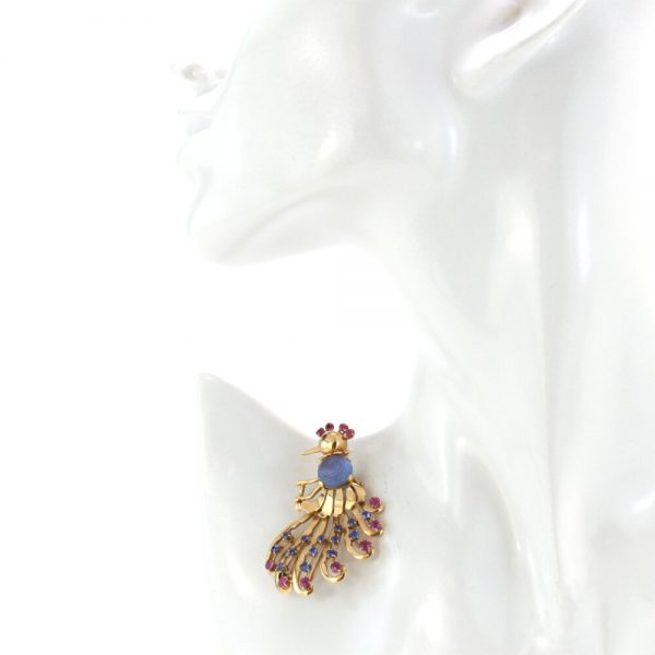 Vintage 2.50ct Carved Sapphire and 18ct Gold Peacock Brooch; with a carved sapphire centre, blue sapphires and rubies, Circa 1970s