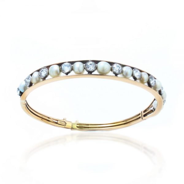 Antique Edwardian Natural Pearl and Old Cut Diamond Bangle Bracelet; set with natural saltwater pearls and 2.75cts old cut diamonds, in 15ct gold and platinum, with GCS certificate for pearls