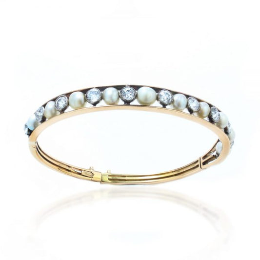 Antique Edwardian Natural Pearl and Old Cut Diamond Bangle Bracelet; set with natural saltwater pearls and 2.75cts old cut diamonds, in 15ct gold and platinum, with GCS certificate for pearls